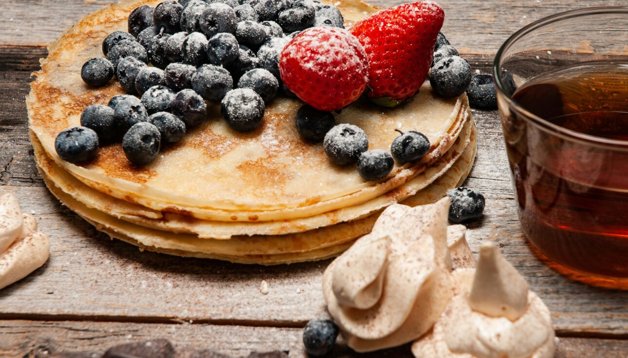 Pancakes With Strawberries and Blueberries On Top