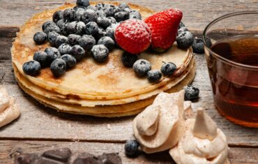 Pancakes With Strawberries and Blueberries On Top