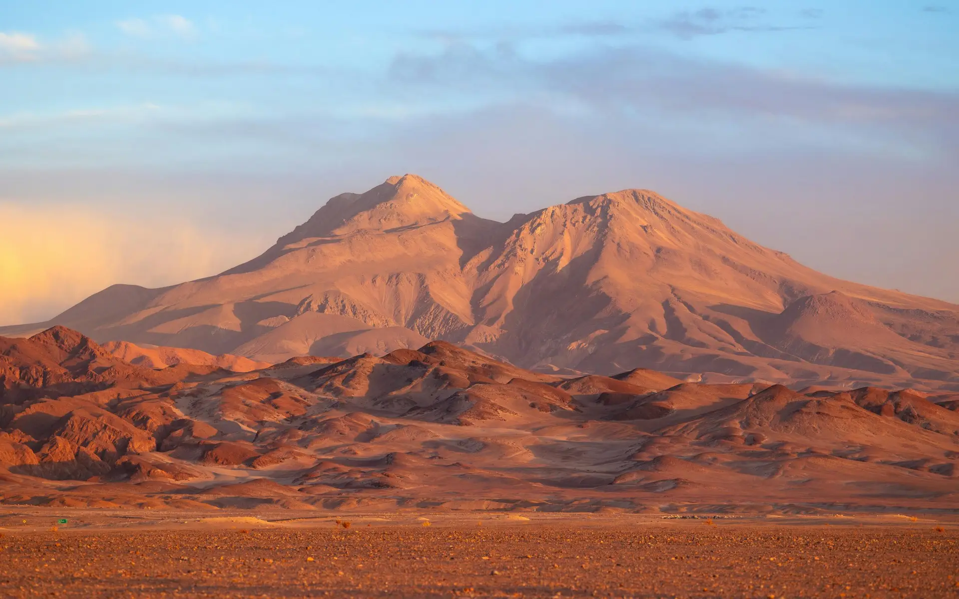 Breathtaking view of mountains in the Atacama Desert, Chile, during a vibrant sunset.